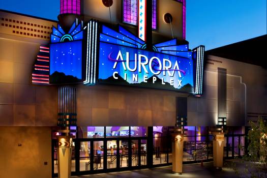 The exterior of the Aurora Cineplex at night.
