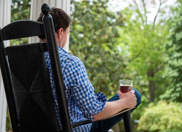 Man in Rocking Chair with Beer